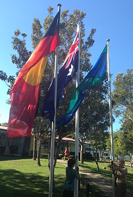 Flagpoles flying the Aboriginal, Australian and Torres Strait Island flags